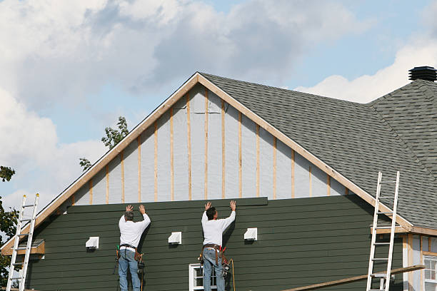 Professional Emergency Siding Repair technician working in Wellsville, PA